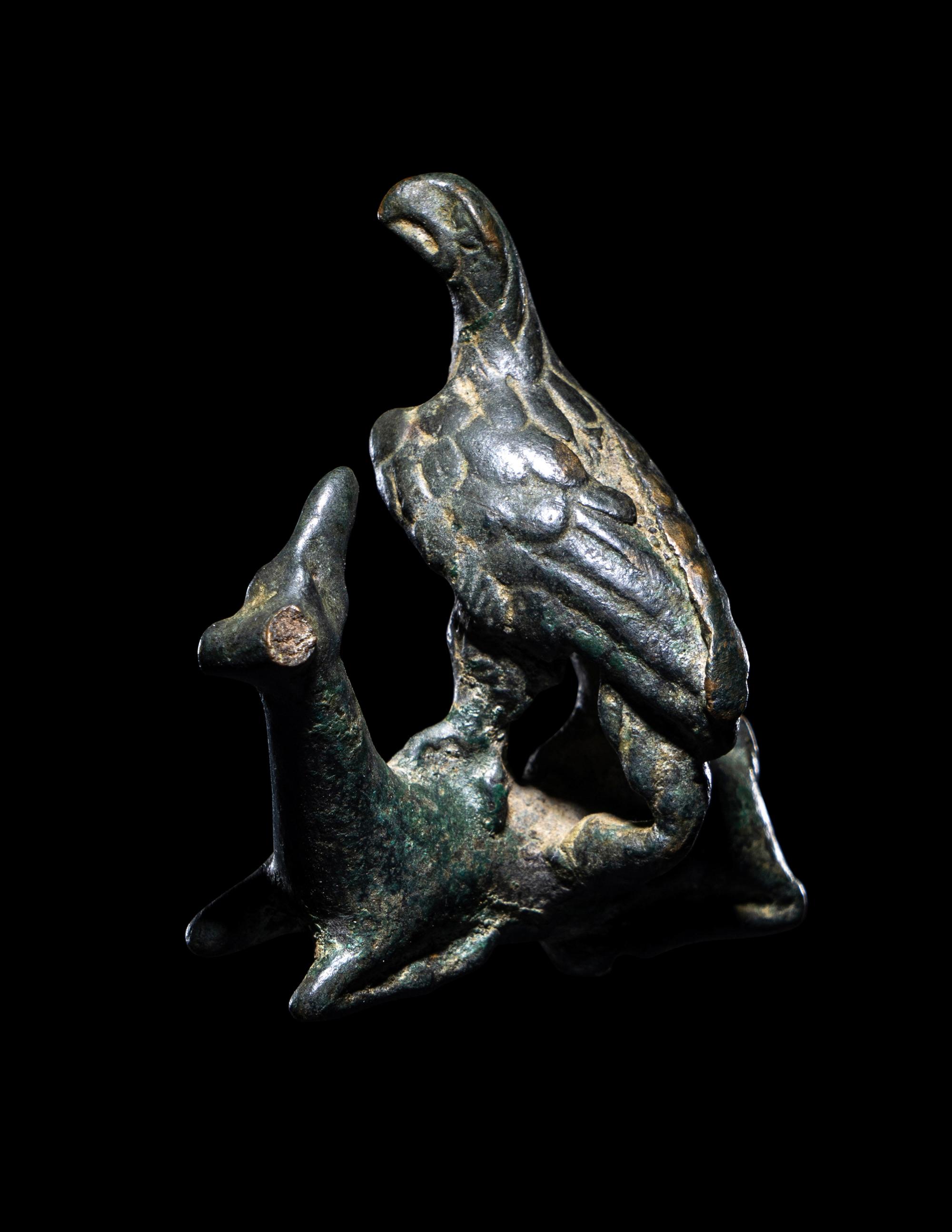 A Roman Bronze Eagle Grasping a Deer