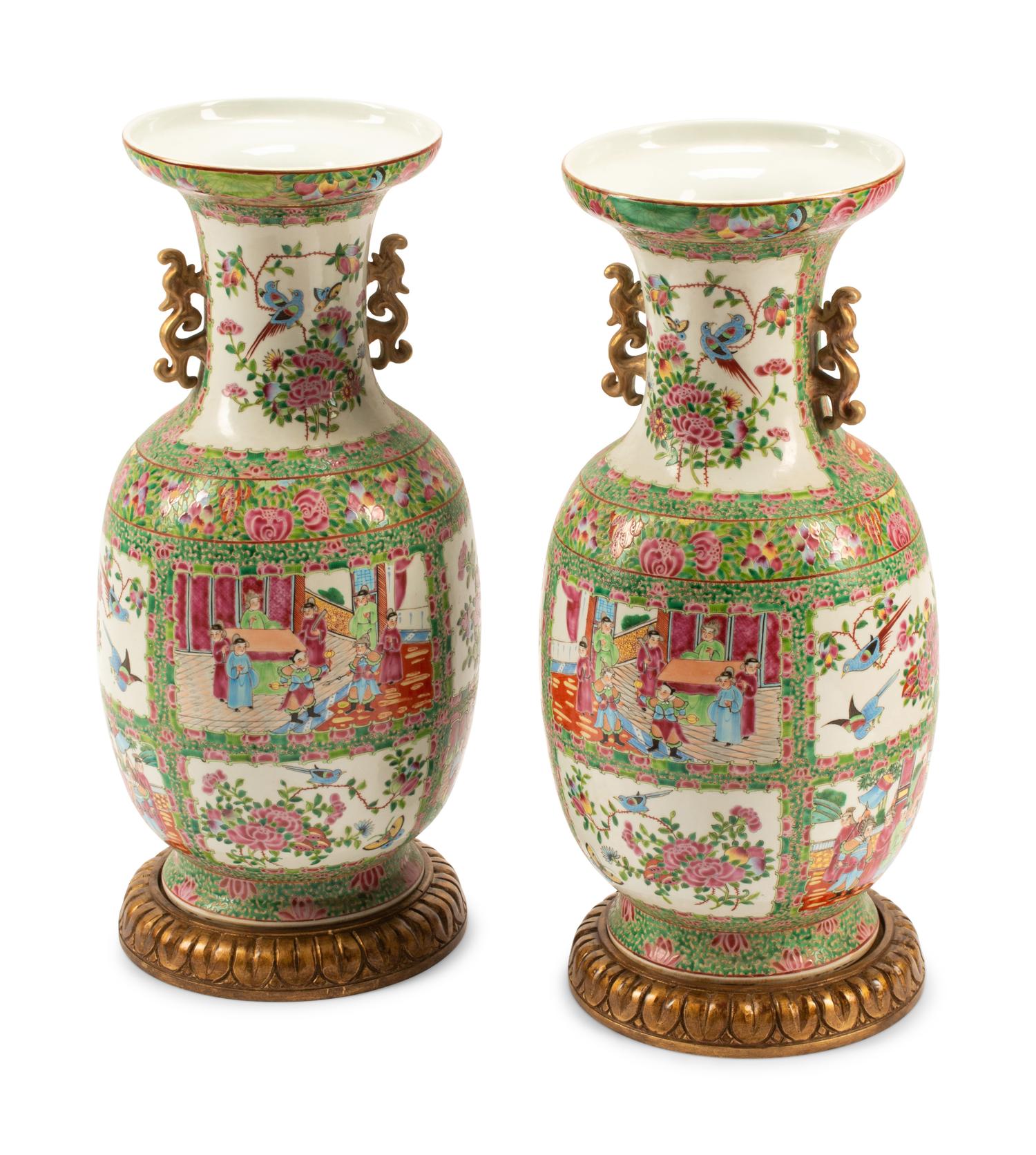 A Pair of Rose Medallion Porcelain Vases on Carved Giltwood Bases