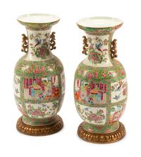 A Pair of Rose Medallion Porcelain Vases on Carved Giltwood Bases