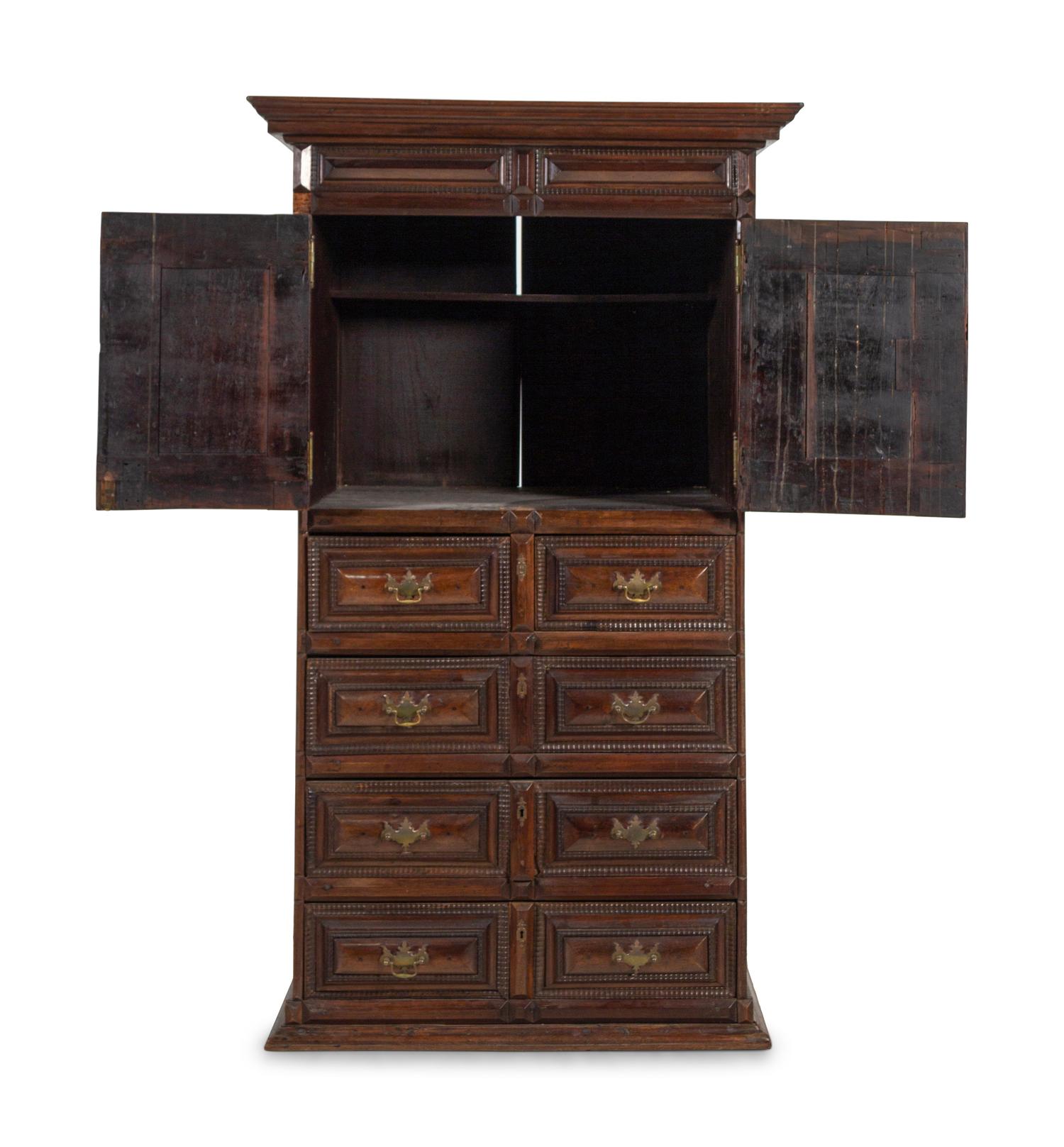 A Dutch Carved and Paneled Walnut Tall Chest of Drawers