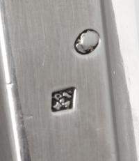 A Pair of French Silver Three-Light Candelabra, Maker's Mark CBA, 19th Century, the stem of faceted tapering form issuing two scrolling
