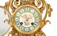 A French Gilt Bronze and Sèvres Porcelain Clock Garniture