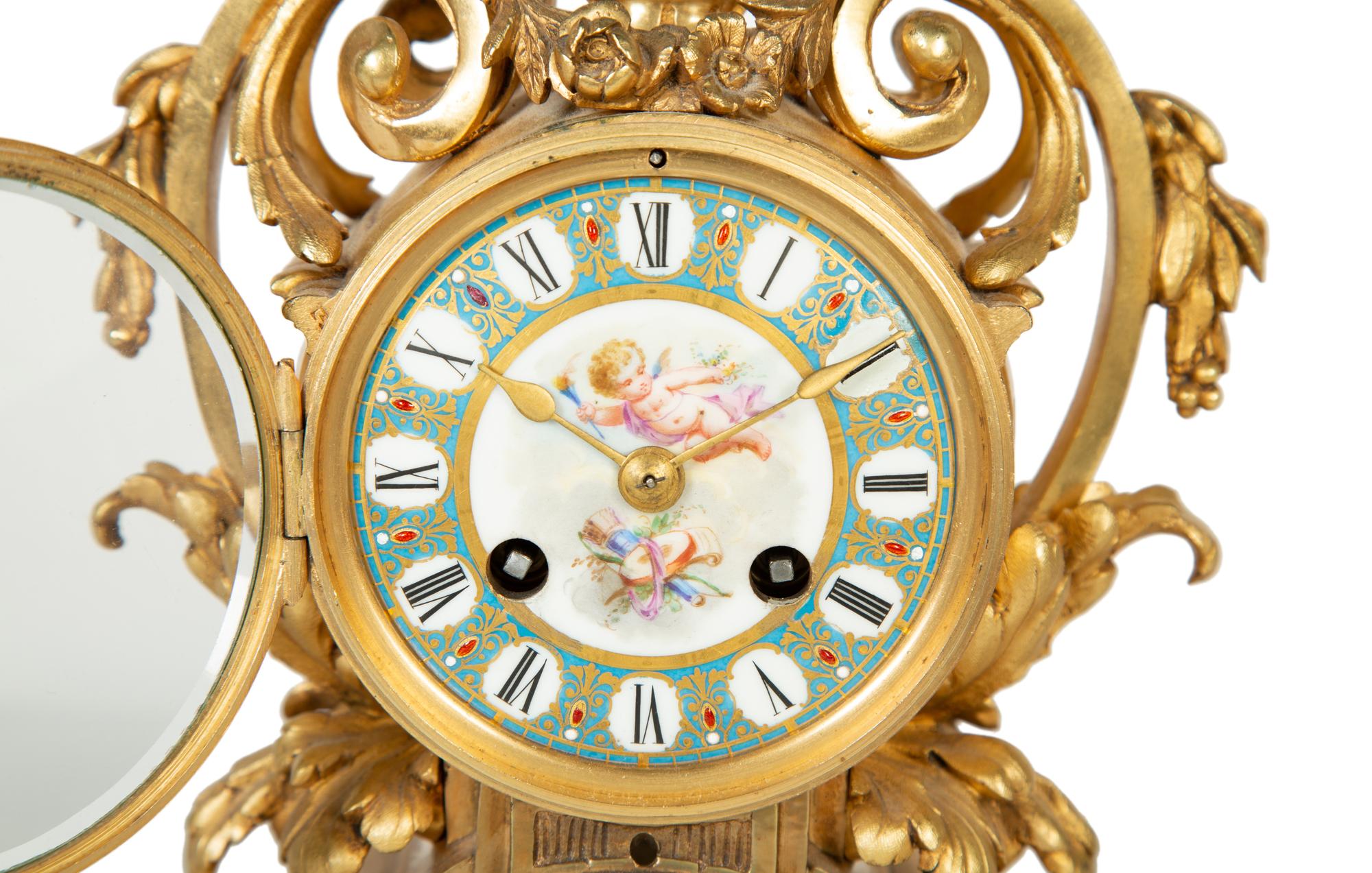 A French Gilt Bronze and Sèvres Porcelain Clock Garniture