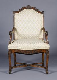 A Louis XV Style Carved Walnut Fauteuil, Height 41 3/4 inches.