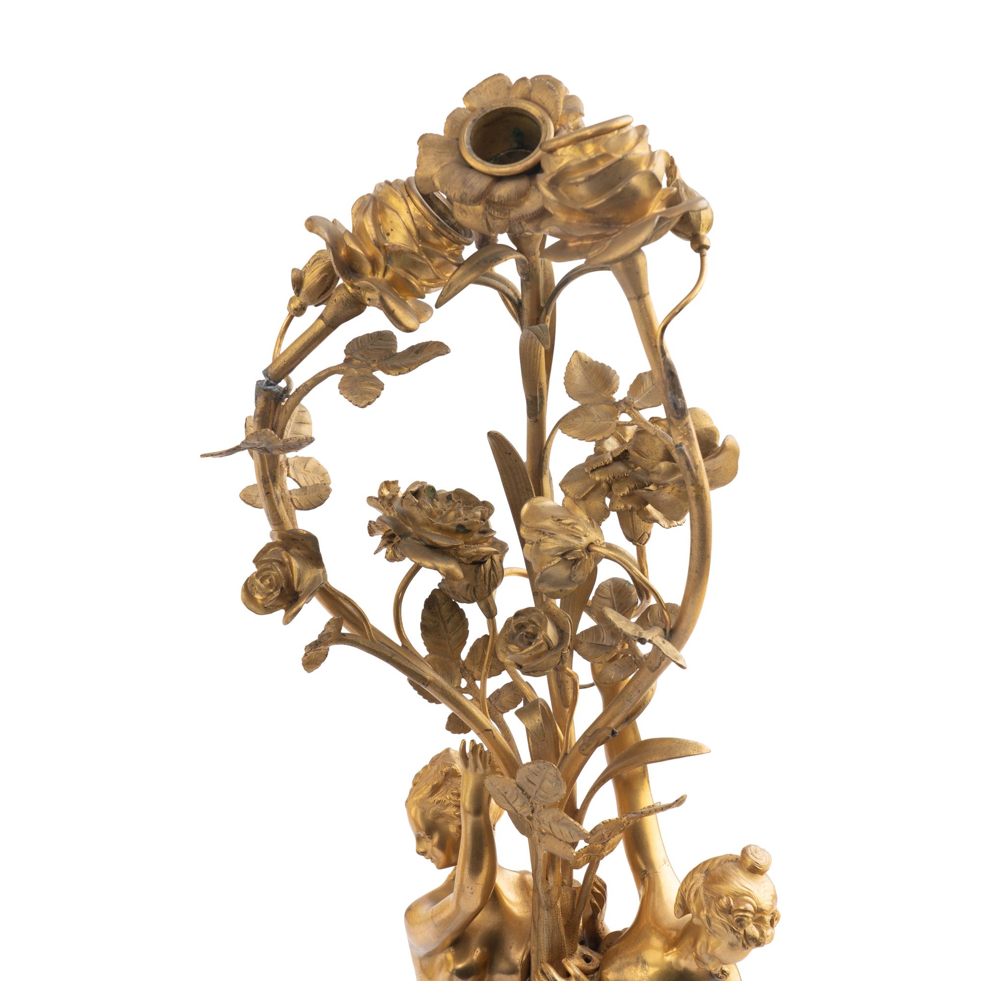 A Louis XVI Style Gilt-Bronze and White Marble Annular Clock Garniture
