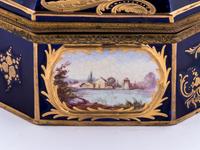 A Sèvres Style Gilt Metal Mounted, Painted and Parcel Gilt Porcelain Table Casket