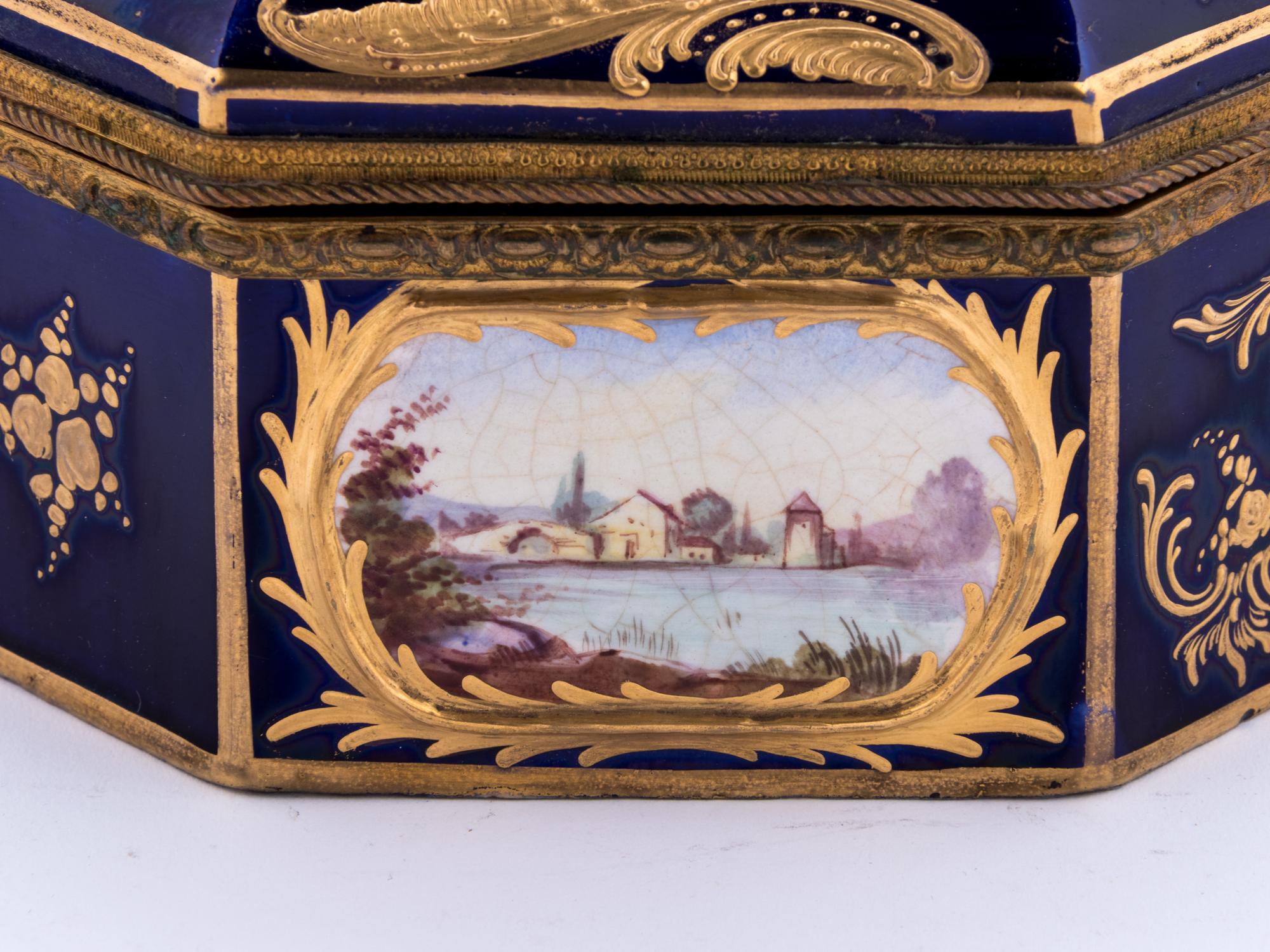A Sèvres Style Gilt Metal Mounted, Painted and Parcel Gilt Porcelain Table Casket