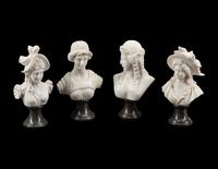 A Set of Four Bi-Color Marble Busts