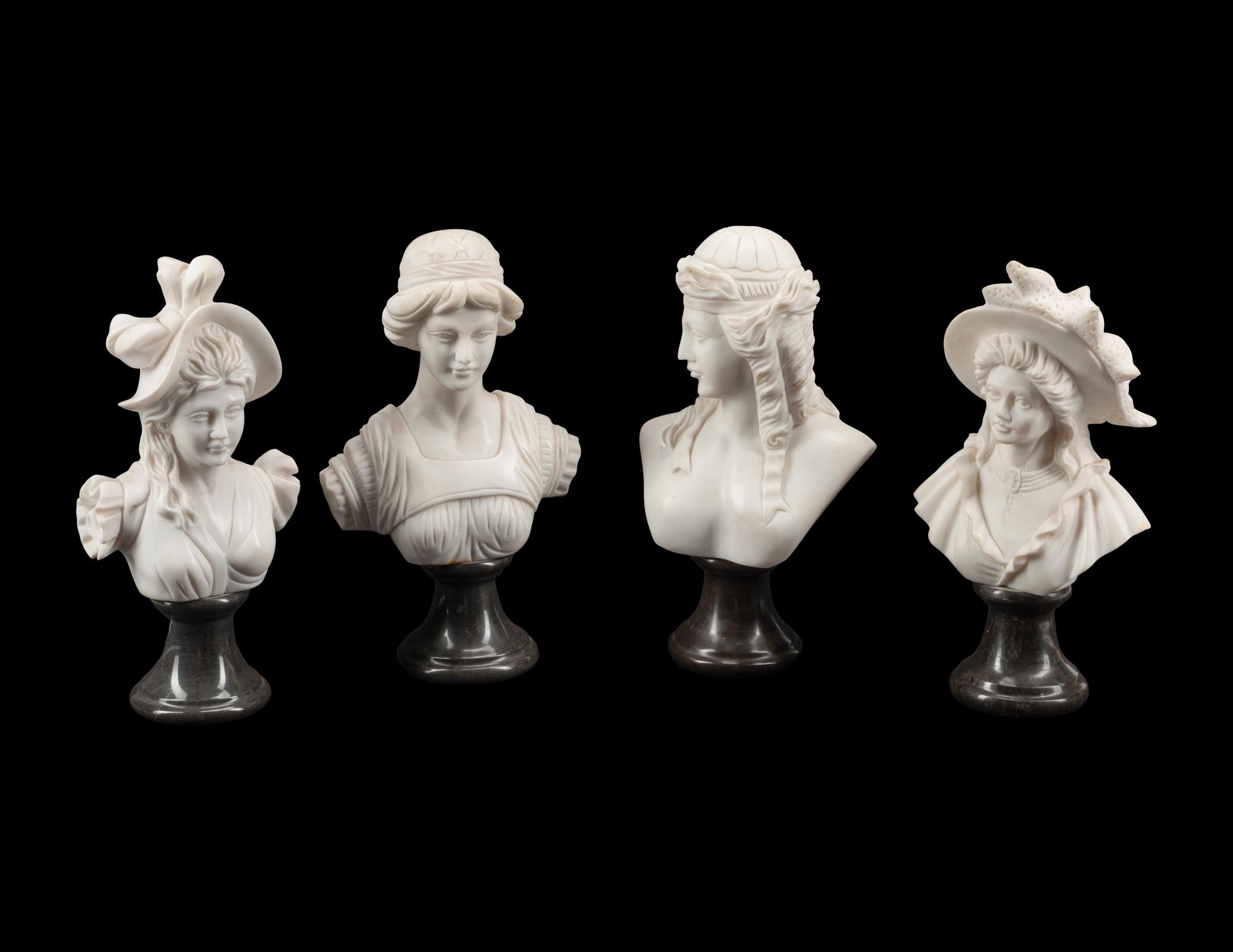 A Set of Four Bi-Color Marble Busts