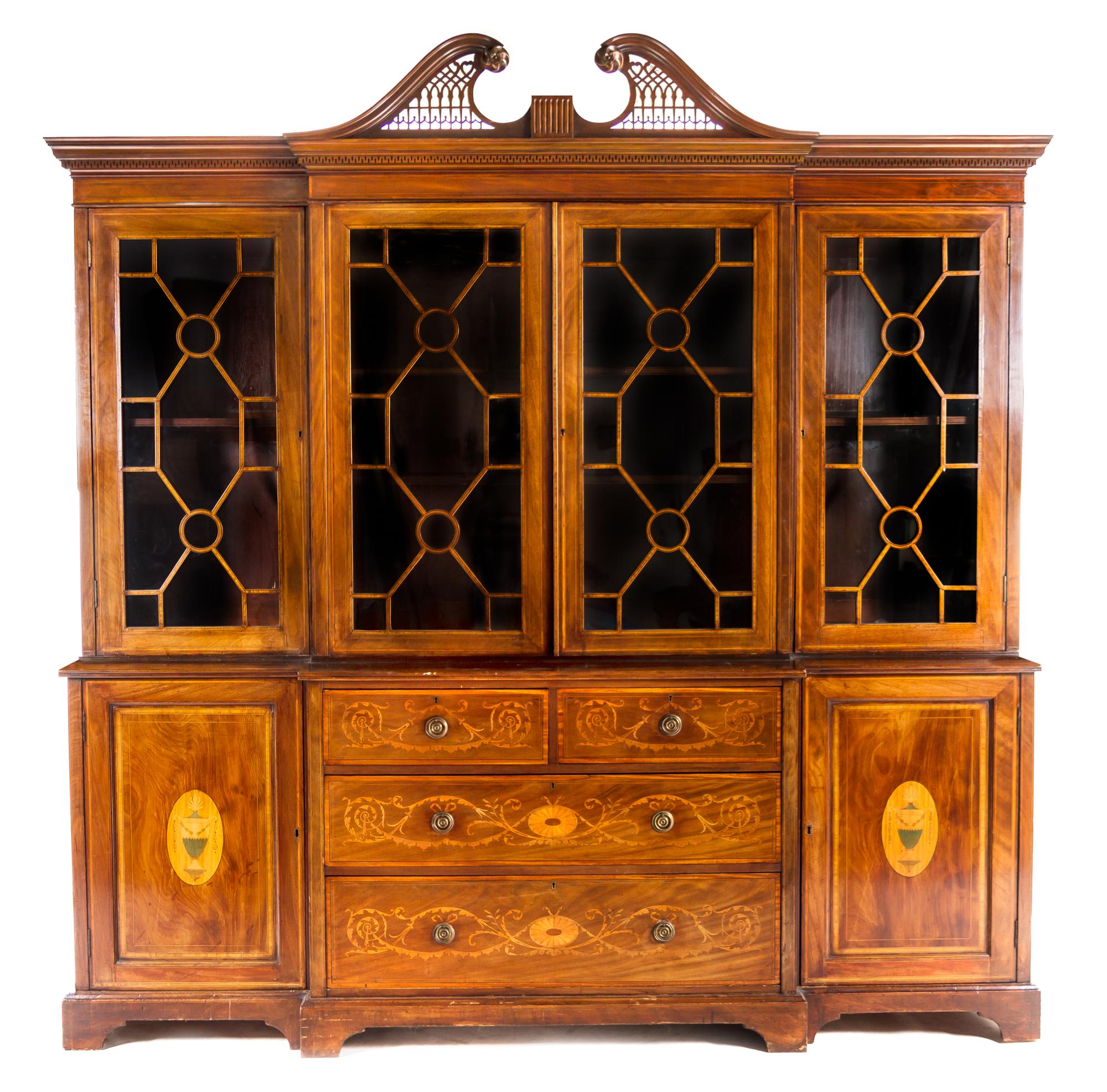 An English Mahogany Breakfront Bookcase HEAL & SON, LONDON, EARLY 20TH CENTURY Height 96 x width 91 x depth 25 inches. — HEAL & SON, LONDON, EARLY 20TH CENTURY
