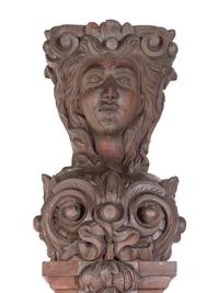 A Pair of Continental Carved Oak Figural Pilasters