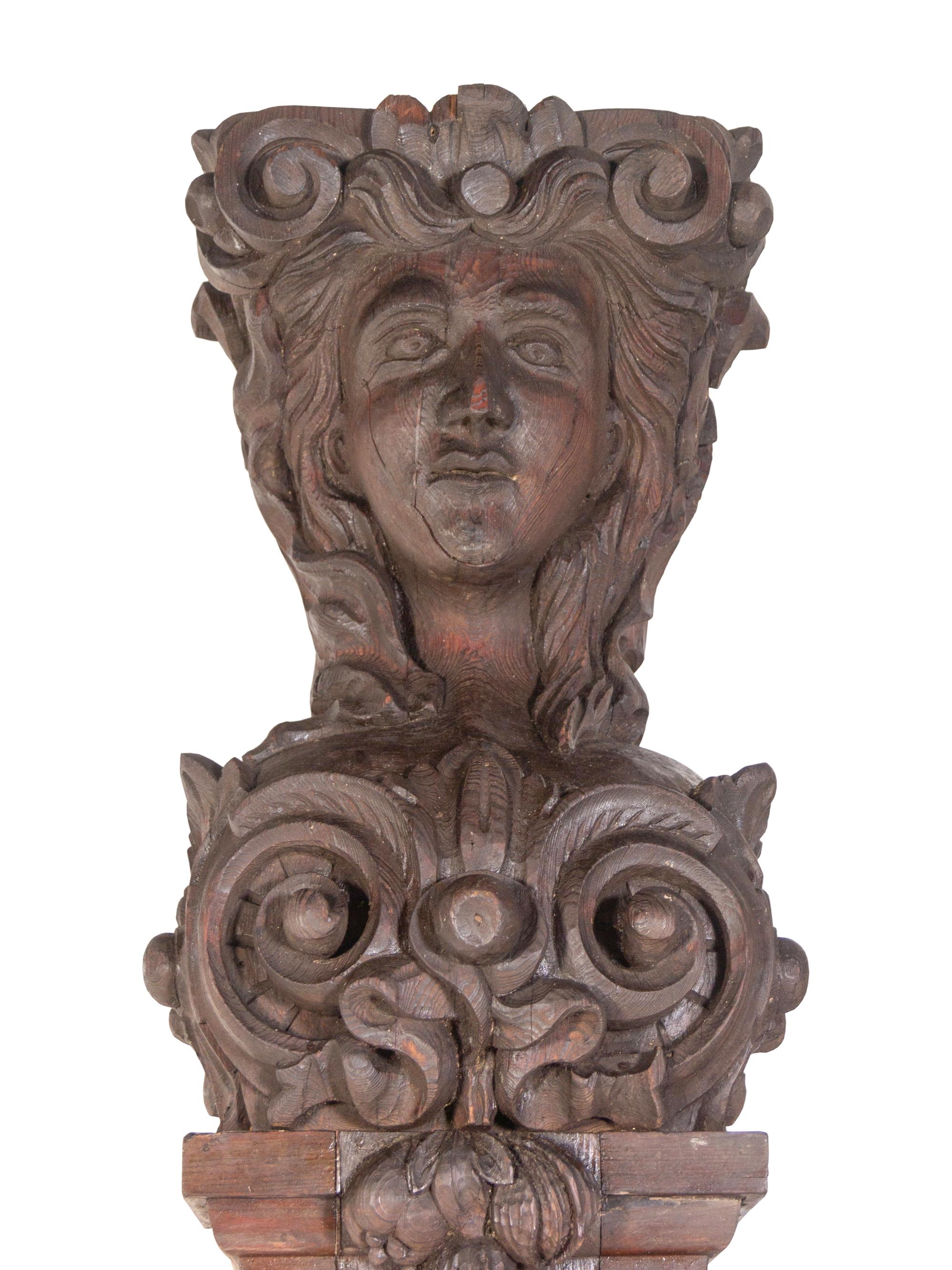 A Pair of Continental Carved Oak Figural Pilasters