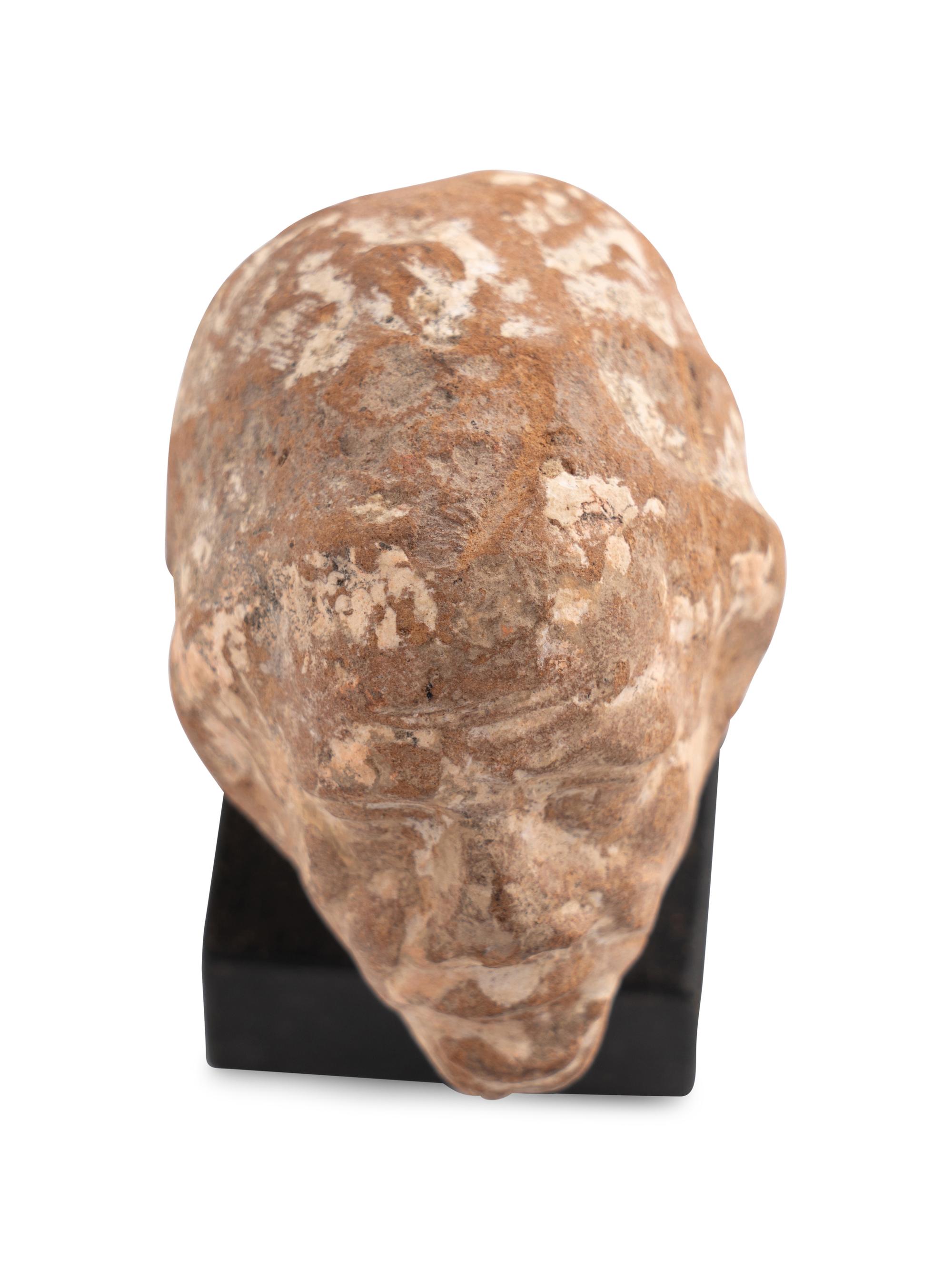 A Romano-Egyptian Terracotta Head of a Grotesque