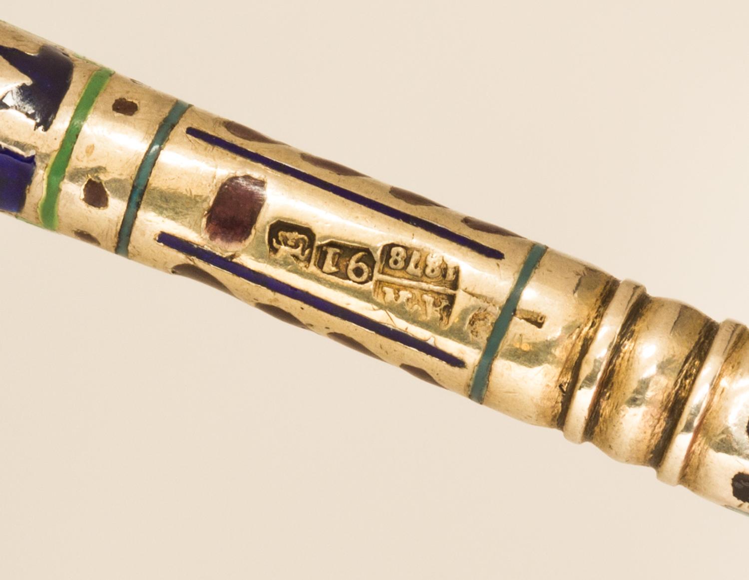 A Russian Silver and Enamel Spoon, Maker's mark likely of P. Ovchinnikov, assay mark obscured, Moscow, 1878, the handle with polychrome