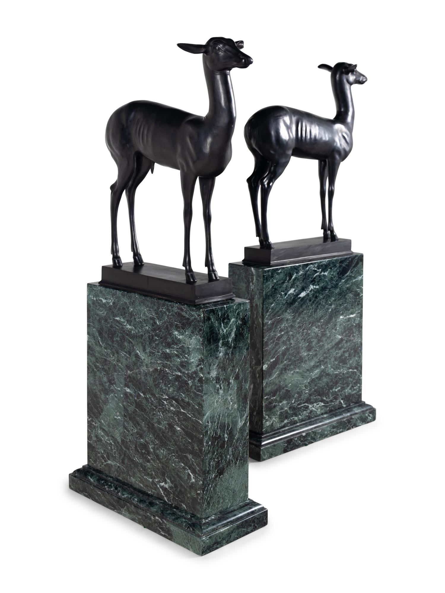 A Pair of Bronze Models of Pompeiian Deer on Marble Plinths