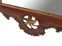 A George III Style Carved and Parcel Gilt Mahogany Mirror