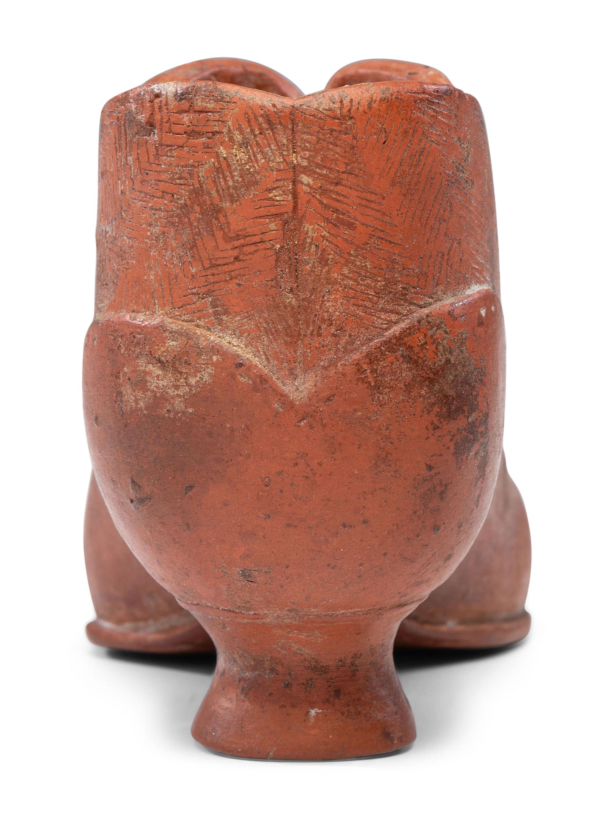 A Glazed Pottery Woman's High-Heeled Shoe