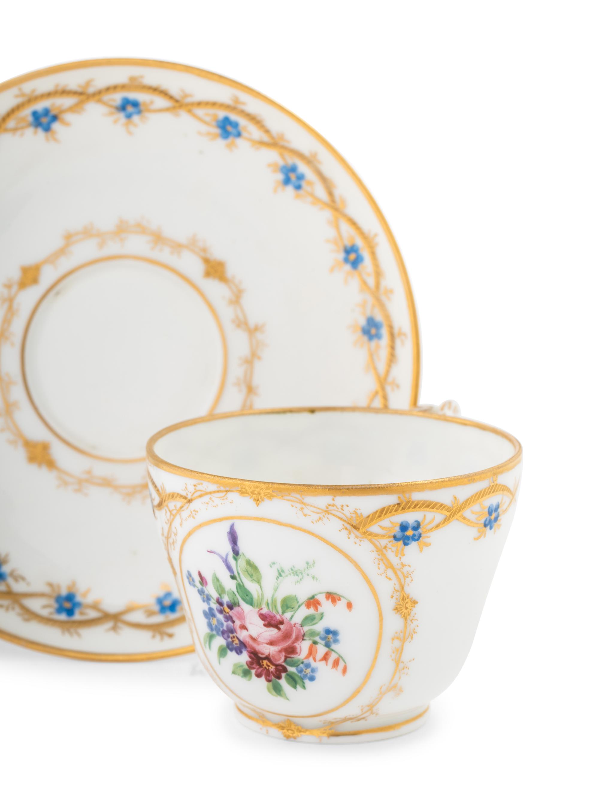A Nicholas II Imperial Porcelain Factory Teacup and Saucer