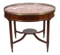A Louis XVI Style Mahogany Bouillotte Table Height 32 x diameter 40 1/2 inches.