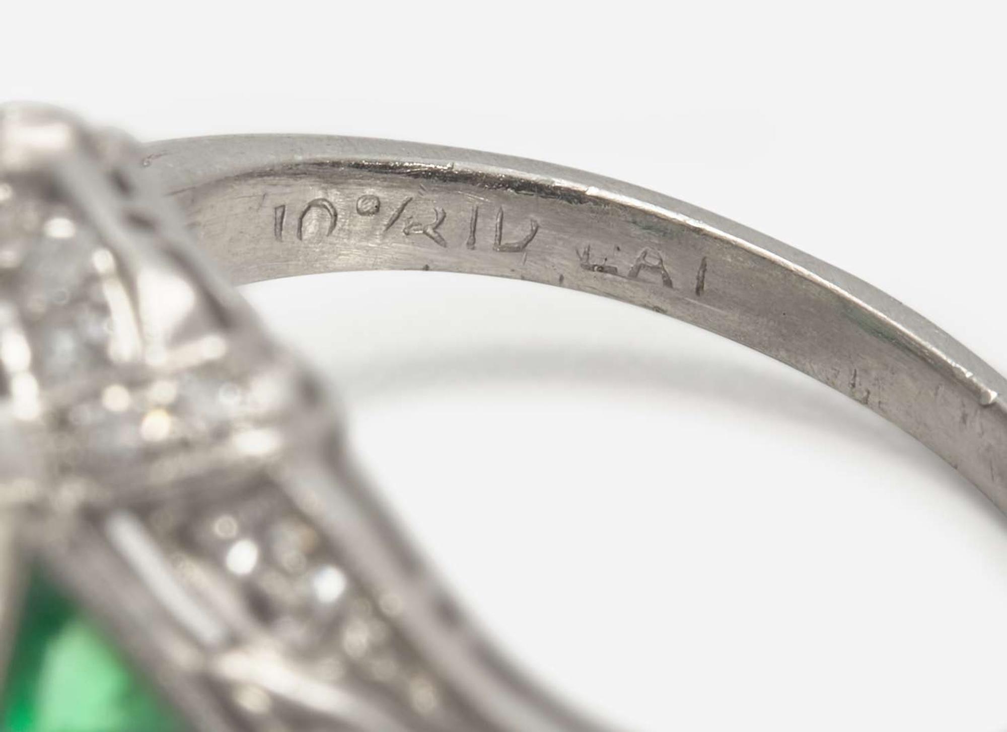 A Platinum, Diamond, and Emerald Art Deco Ring