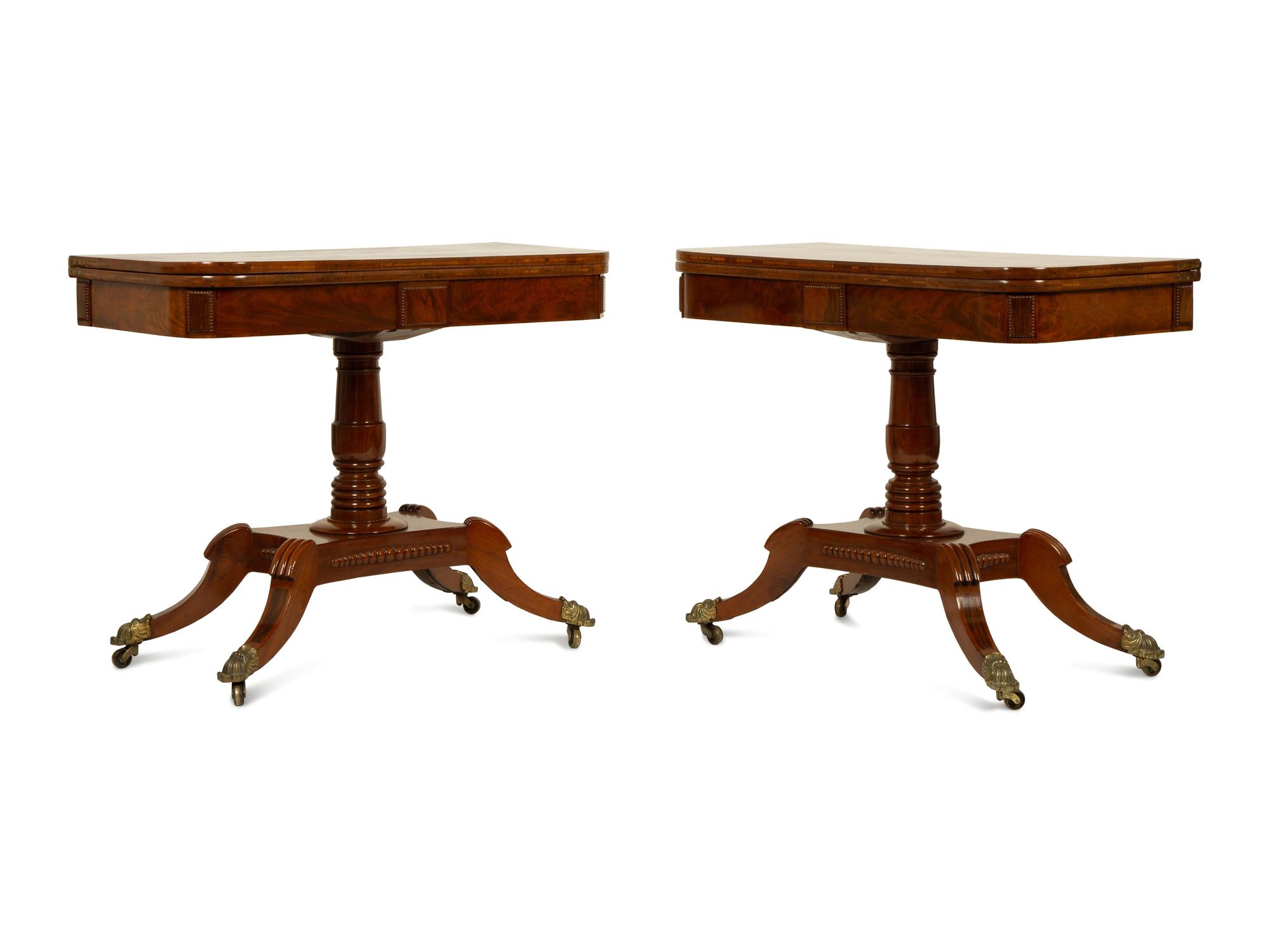 A Pair of Regency Flame Mahogany Flip-Top Games Tables — 19TH CENTURY