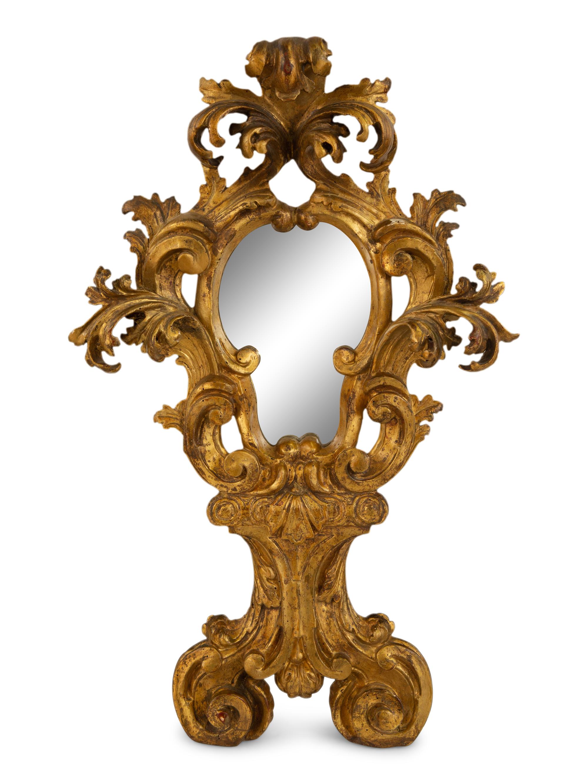 A Venetian Rococo Style Giltwood Mirror