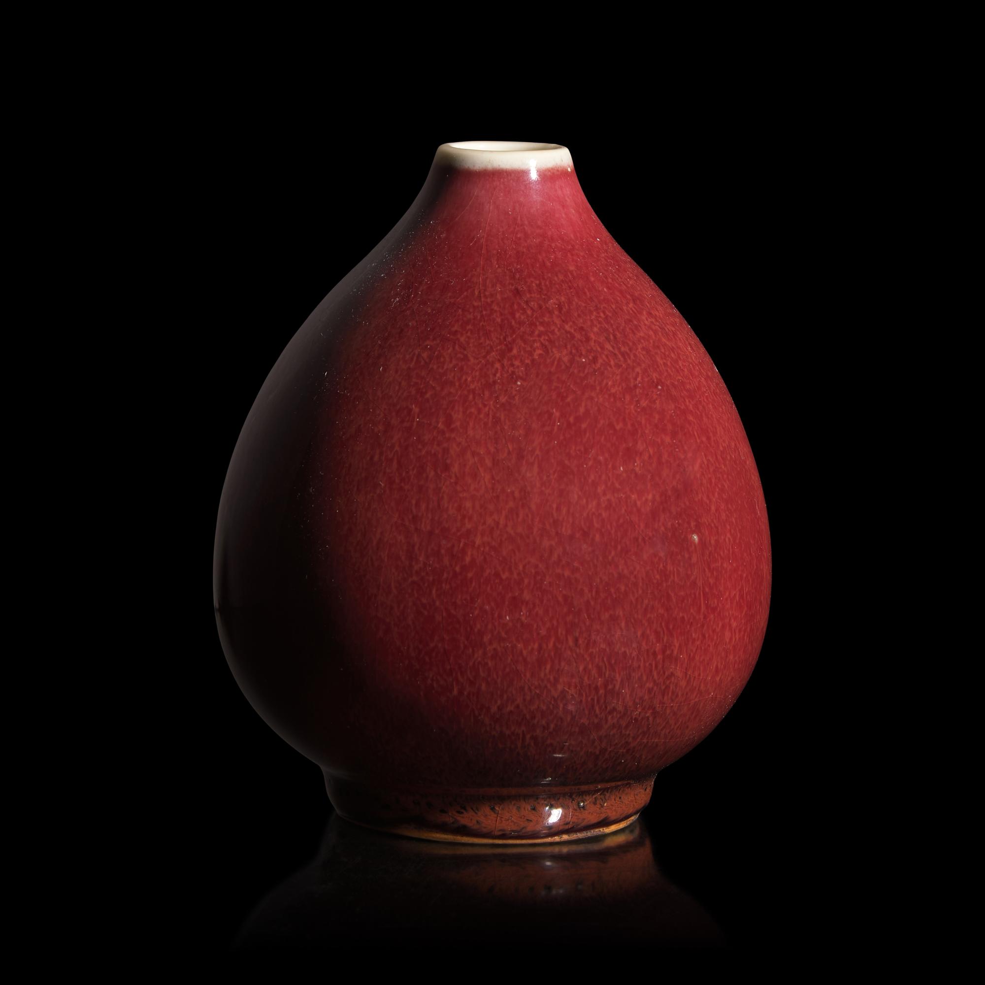 A Chinese Copper Red Glazed Porcelain Bud-Form Jar, 18th Century — 清中期 銅紅釉蓮子罐