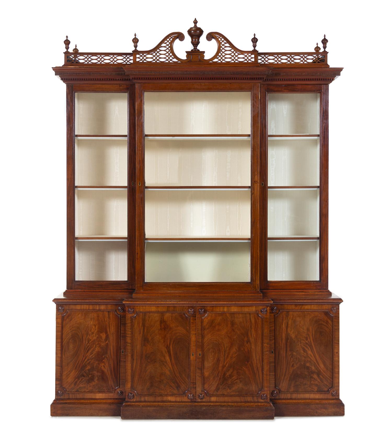 A Late George III Pierce Carved and Figured Mahogany Breakfront Cabinet
