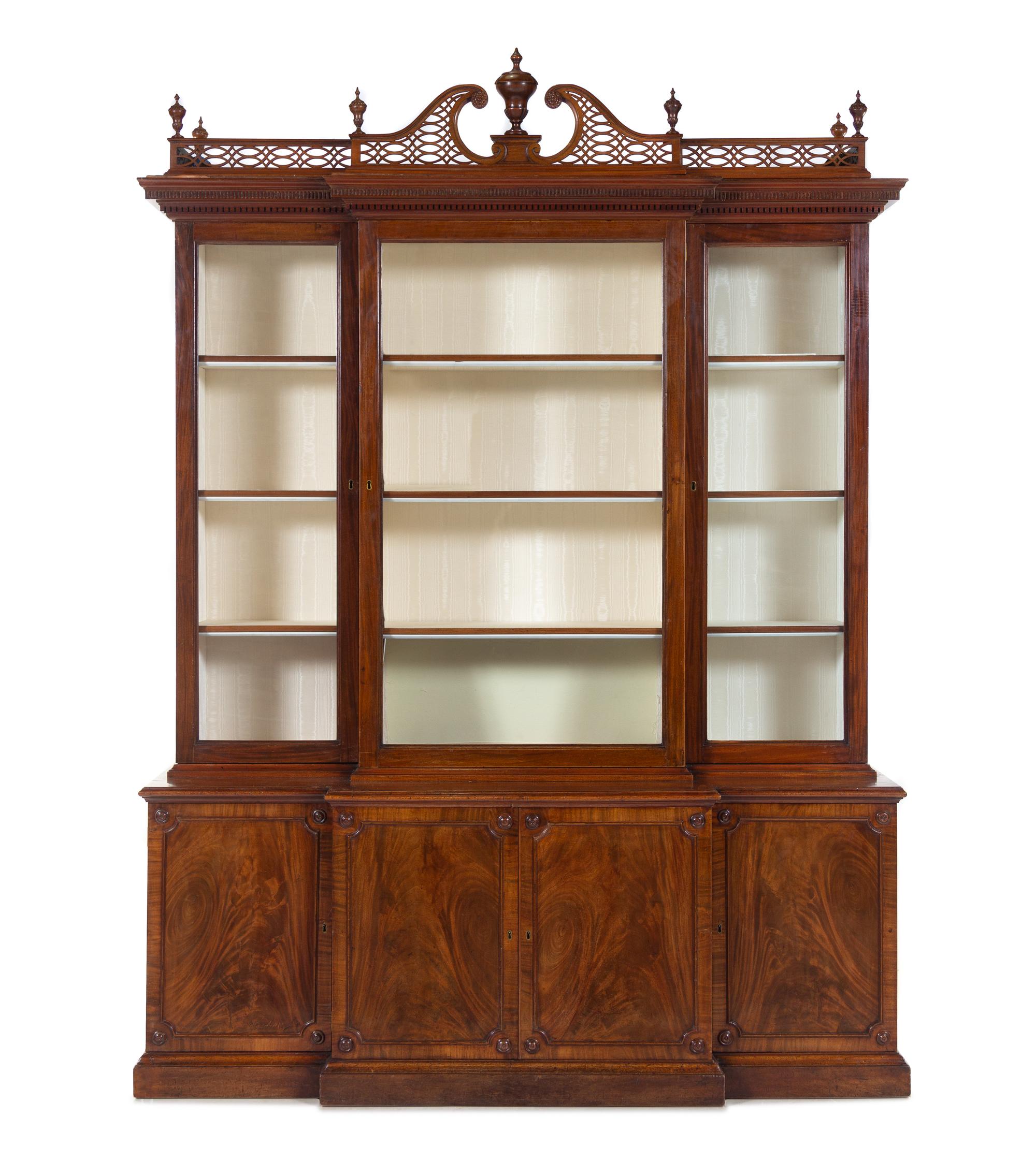 A Late George III Pierce Carved and Figured Mahogany Breakfront Cabinet