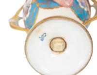 A Fürstenberg Porcelain Gilded Two-Handled Figural Urn
