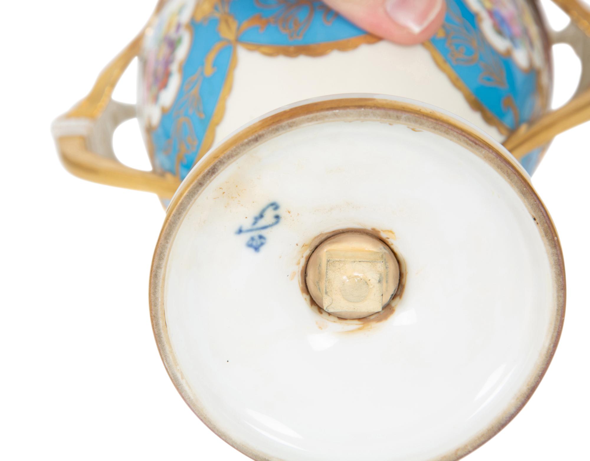 A Fürstenberg Porcelain Gilded Two-Handled Figural Urn
