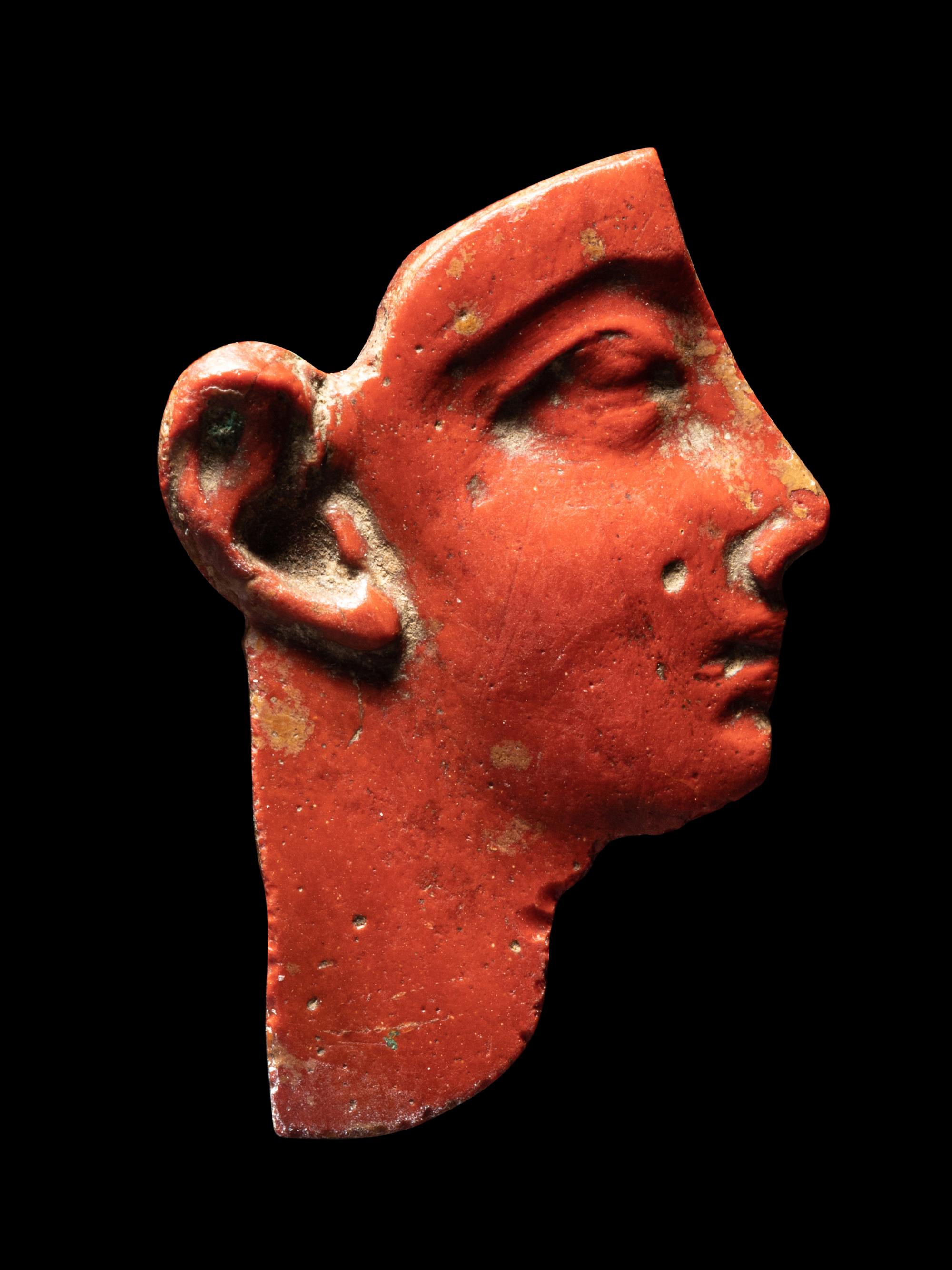 An Egyptian Red Jasper Face Inlay