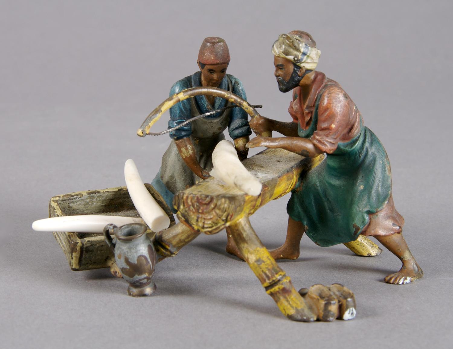 A Cold Painted Bronze Figure of Craftsmen, Height 2 1/2 inches.