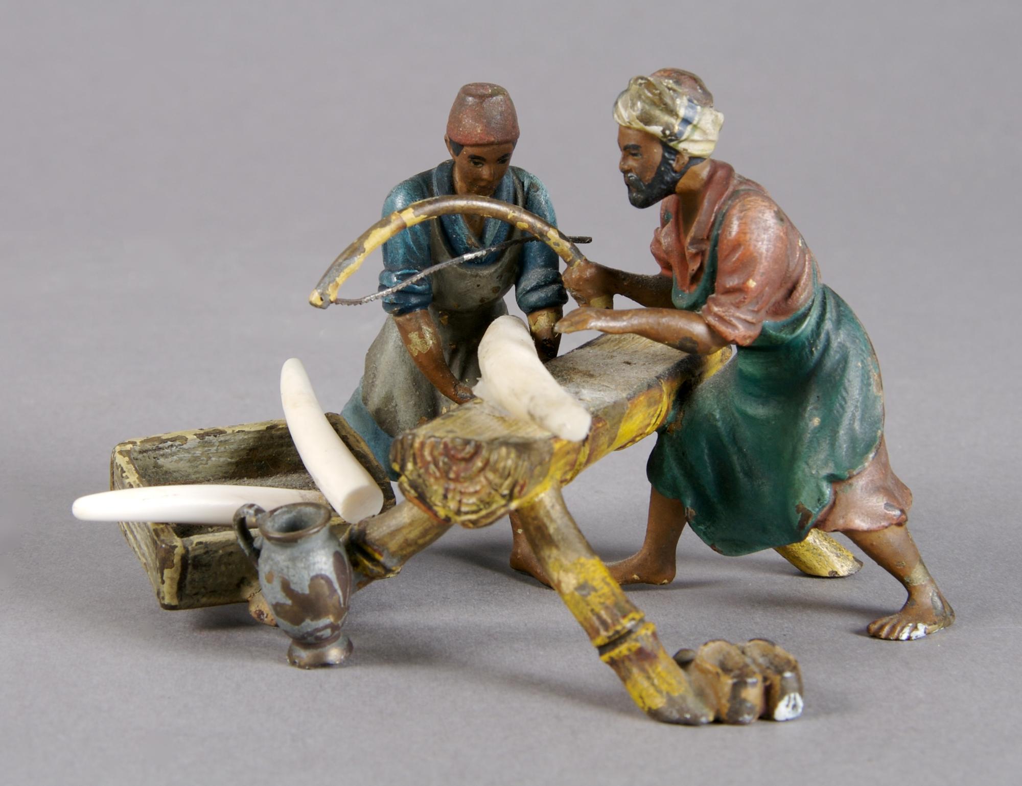 A Cold Painted Bronze Figure of Craftsmen, Height 2 1/2 inches.