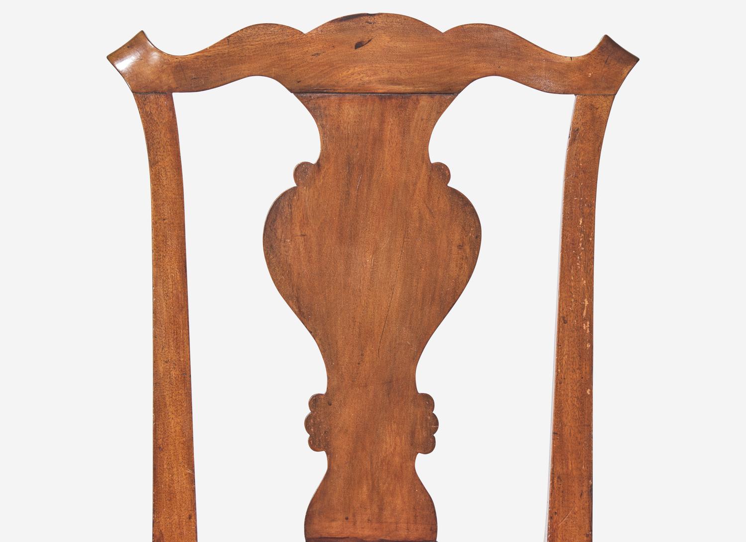 A Set of Four Chippendale Walnut Claw-and-Ball Foot Dining Chairs