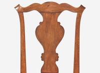 A Set of Four Chippendale Walnut Claw-and-Ball Foot Dining Chairs