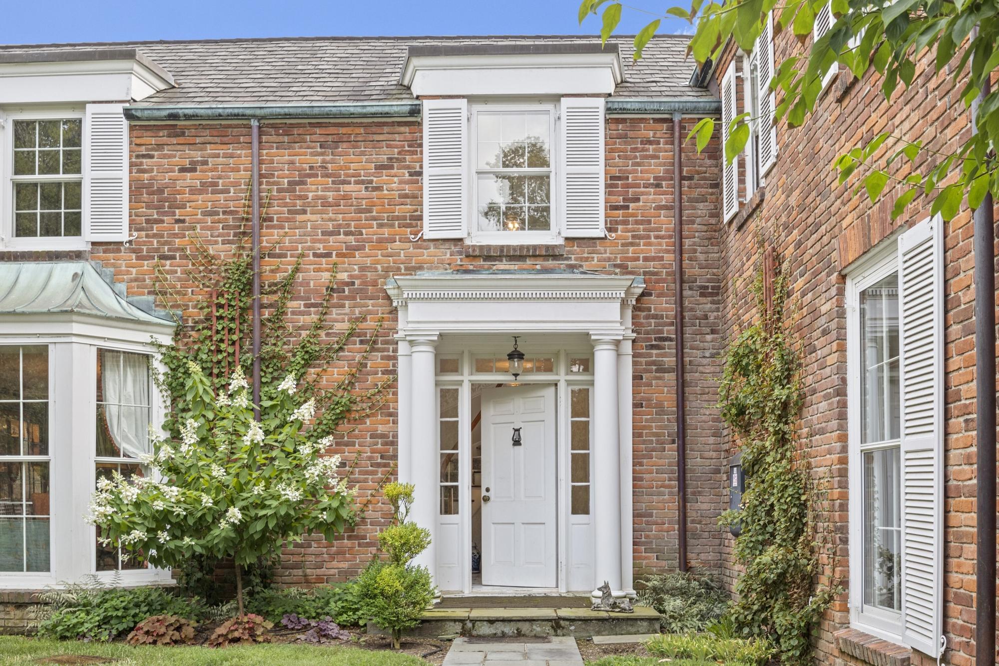 A Country Federal Style Red and Black Paint Decorated Hanging Shelf