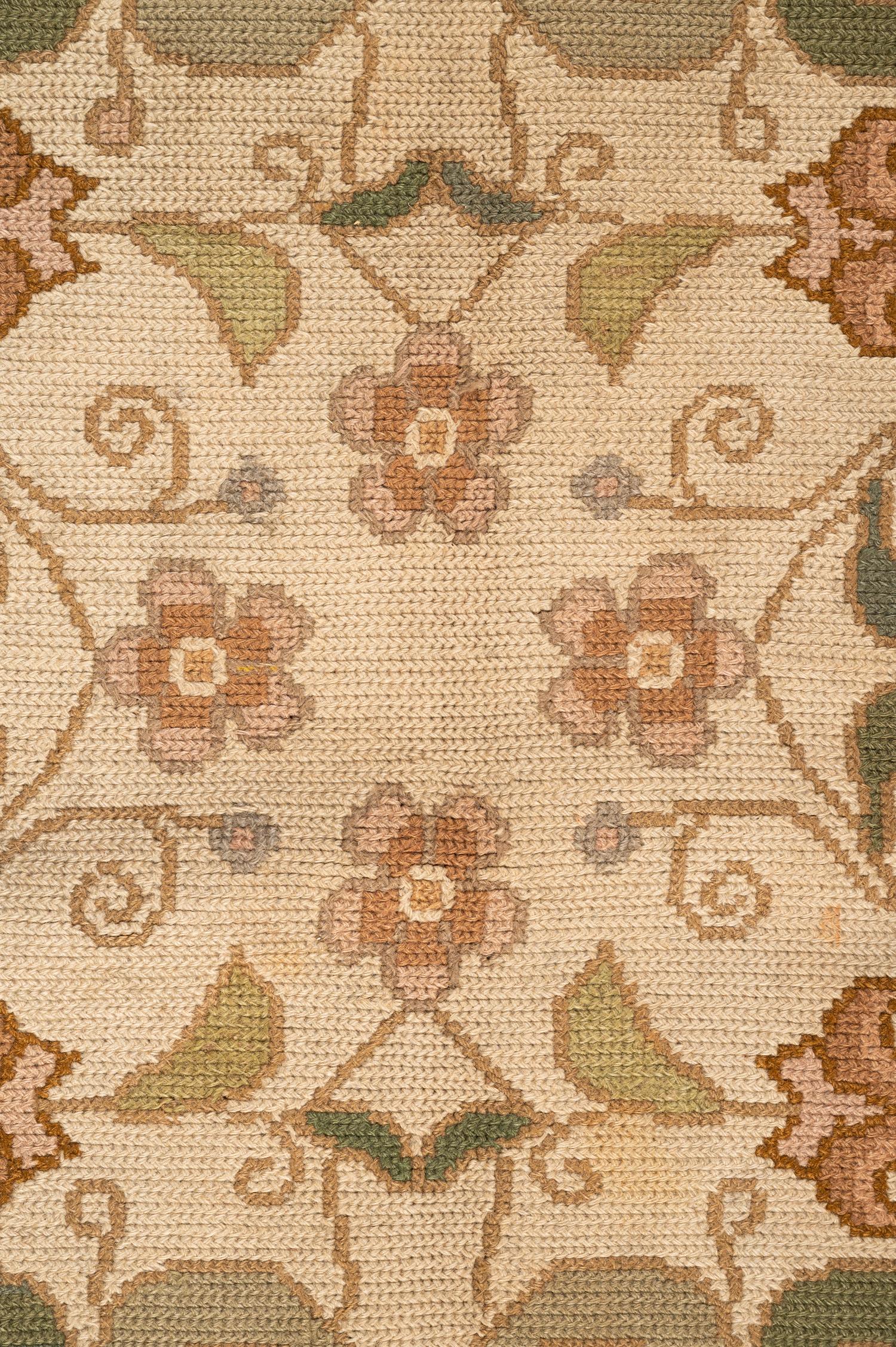 A Portuguese Needlepoint Rug
