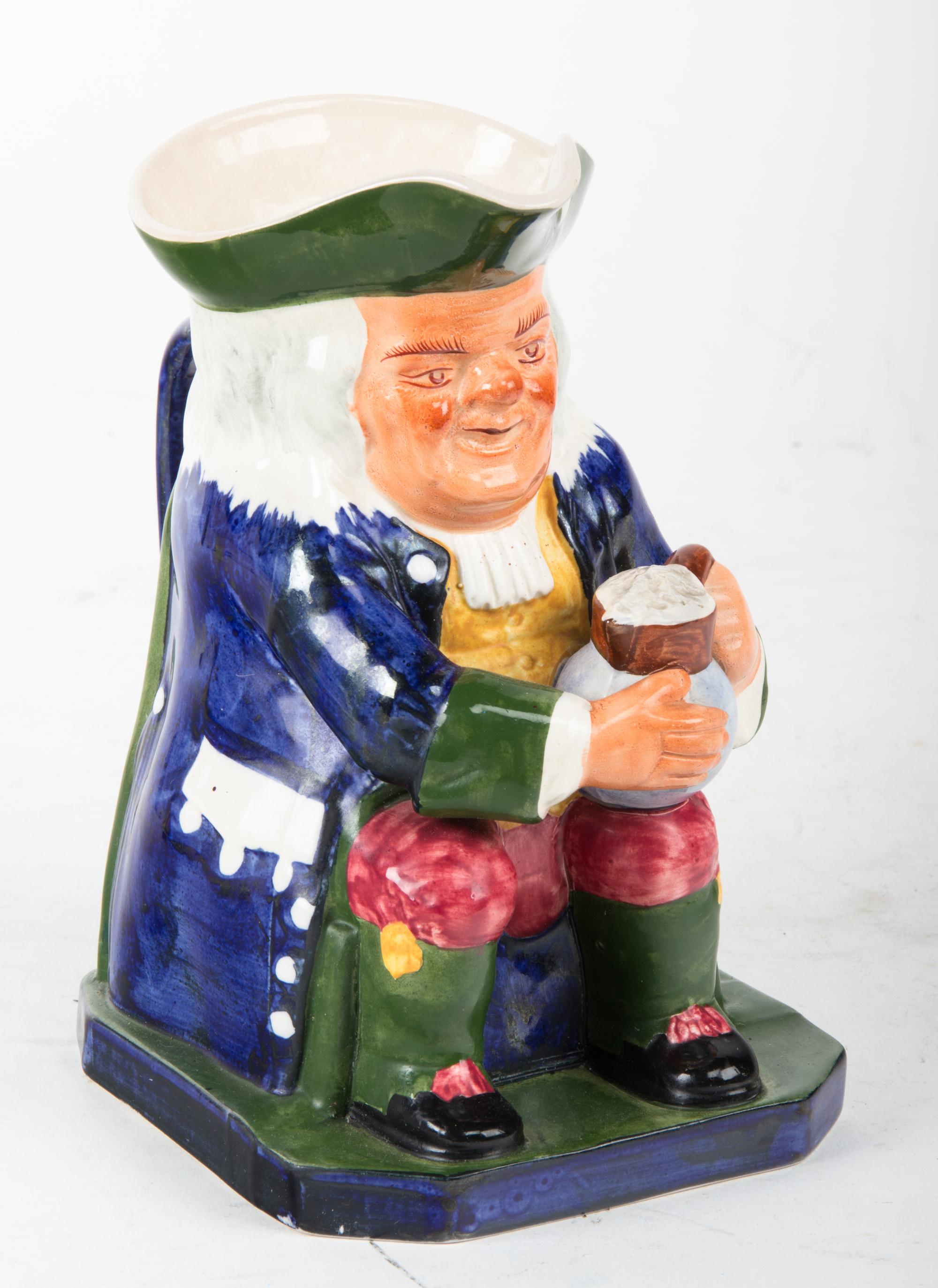 A Spode Pottery Toby Jug Height 8 inches.