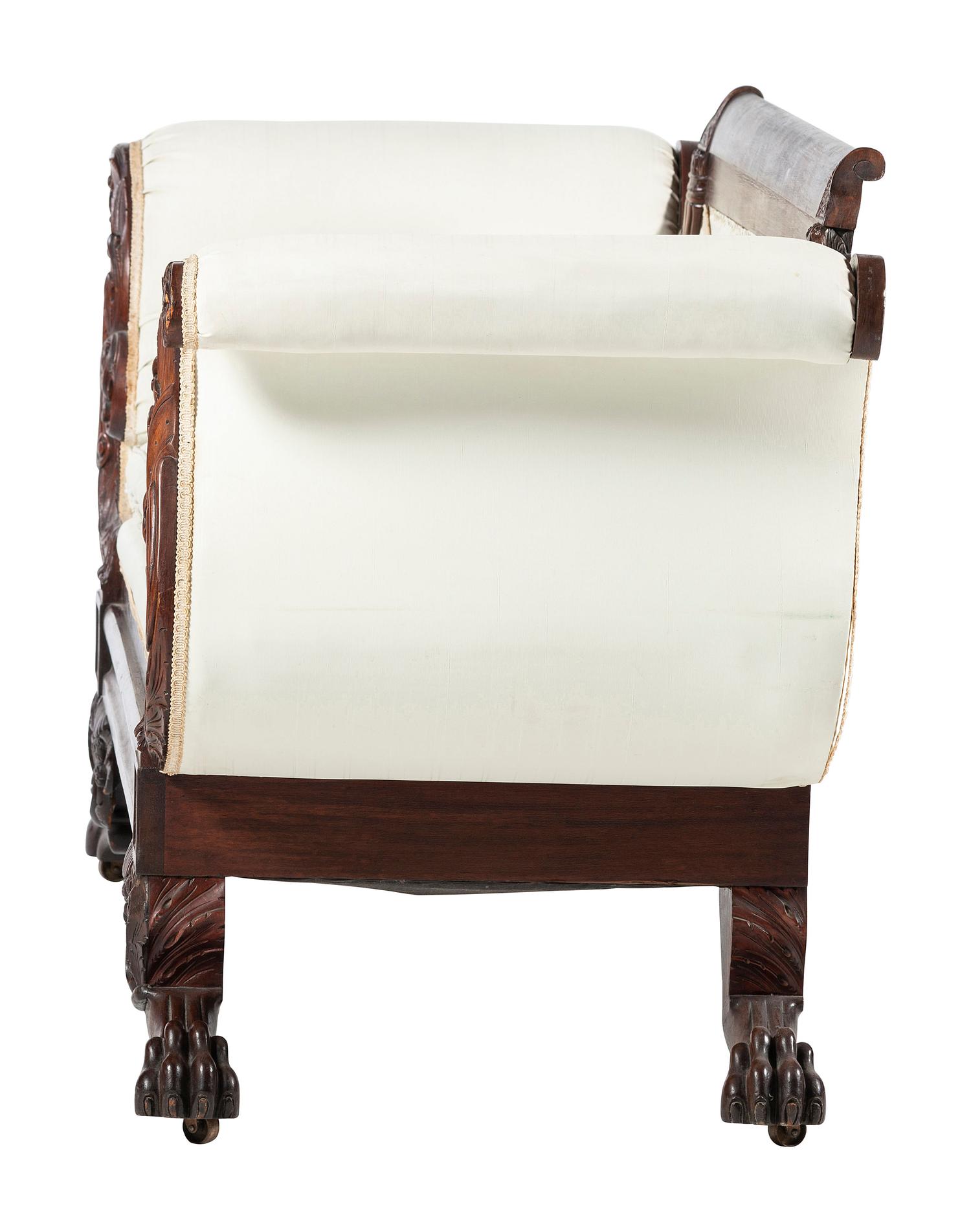 A Late Classical Carved Mahogany Sofa