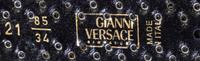 A Gianni Versace Black Leather "Broken Coin" Belt, Size 85/34.