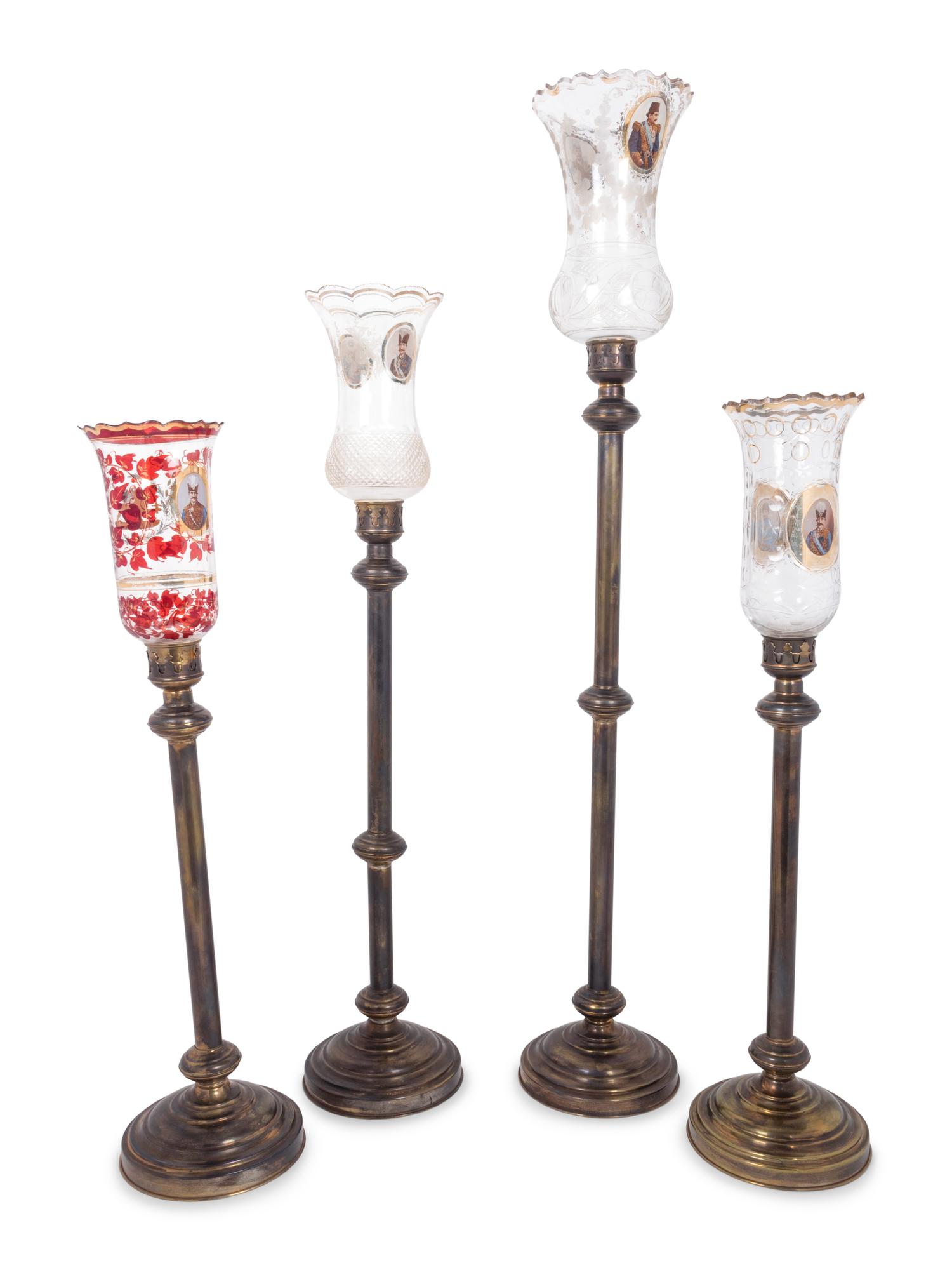 Four Brass and Enameled Glass Hurricane Candlesticks for the Persian Market