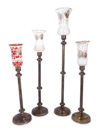 Four Brass and Enameled Glass Hurricane Candlesticks for the Persian Market