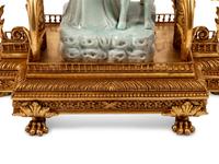 A Continental Gilt Bronze and Celadon Porcelain Figural Chinoiserie Clock