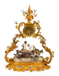 A Louis XV Style Gilt Bronze and Porcelain Figural Clock