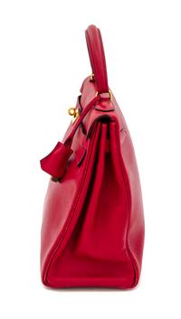 An Hermes Red 32cm Kelly Bag, 12.5" x 9" x 4.5".