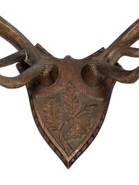 A Continental Carved Oak and Antler Wall Mount