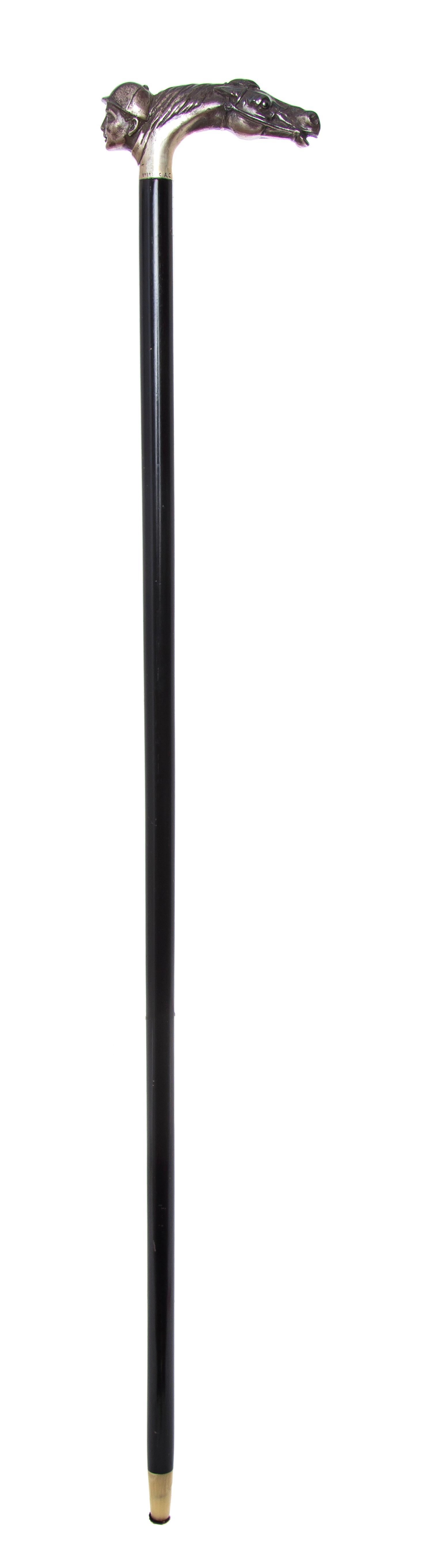 An American Sterling Silver Handled Cane, Length of handle 2 x length overall 31 1/2 inches.