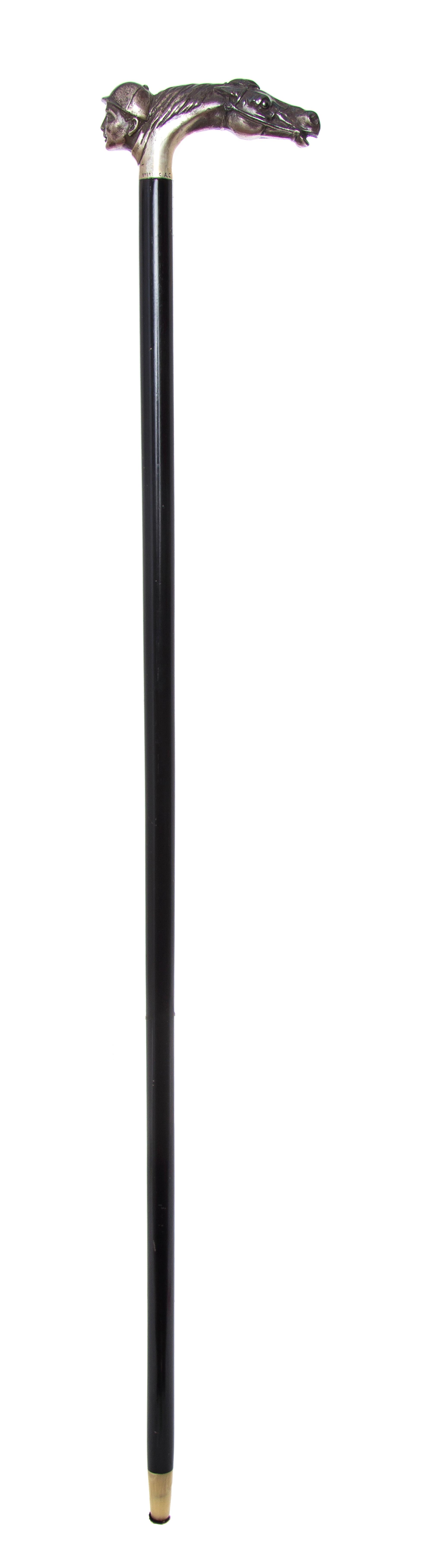 An American Sterling Silver Handled Cane, Length of handle 2 x length overall 31 1/2 inches.