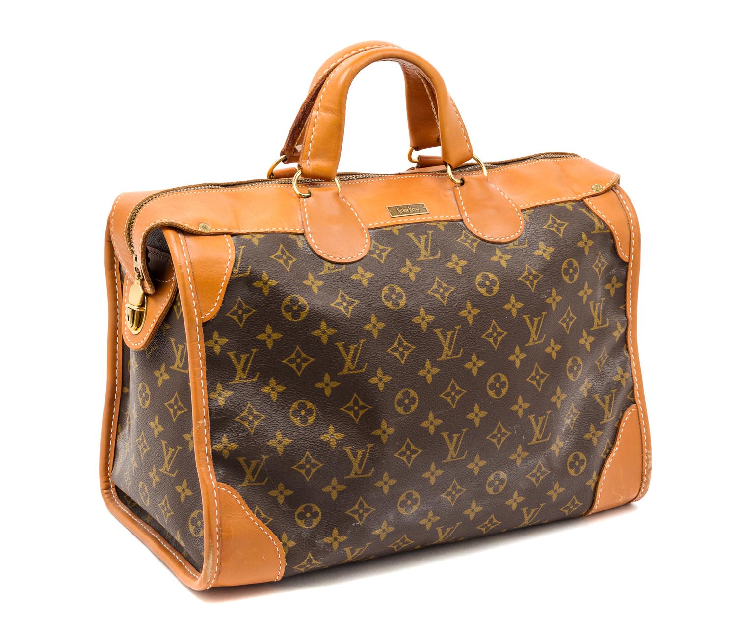 A Louis Vuitton Monogram Canvas Travel Bag, 16" x 13" x 9".